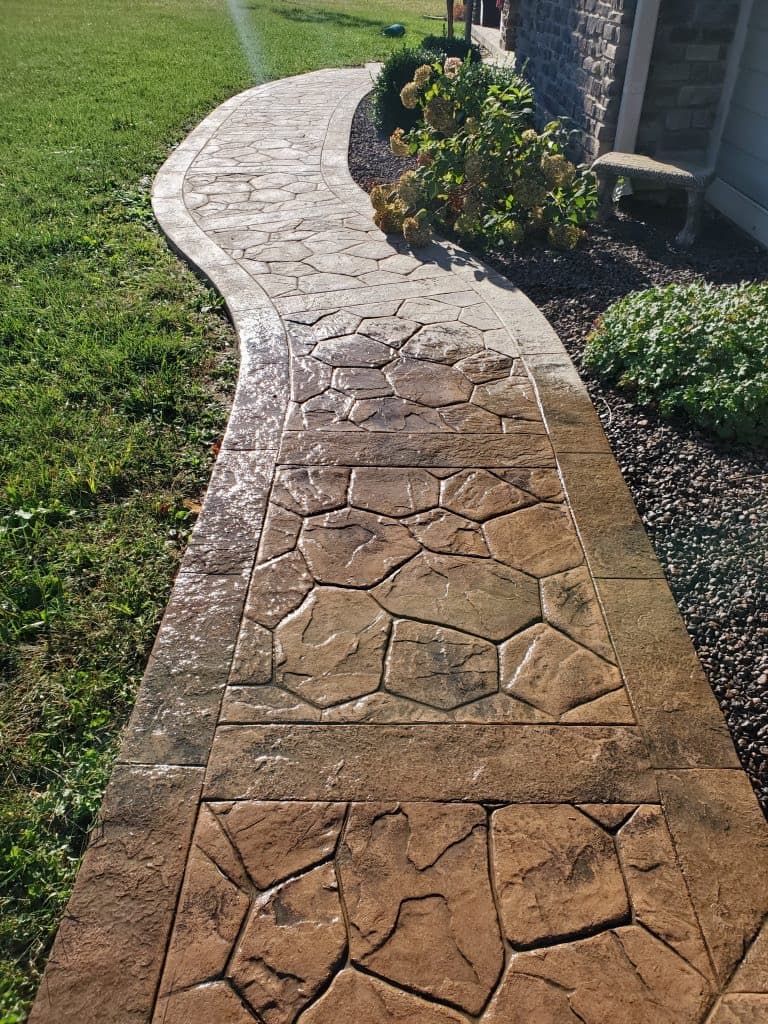 Wet-look sealed stamped concrete walkway