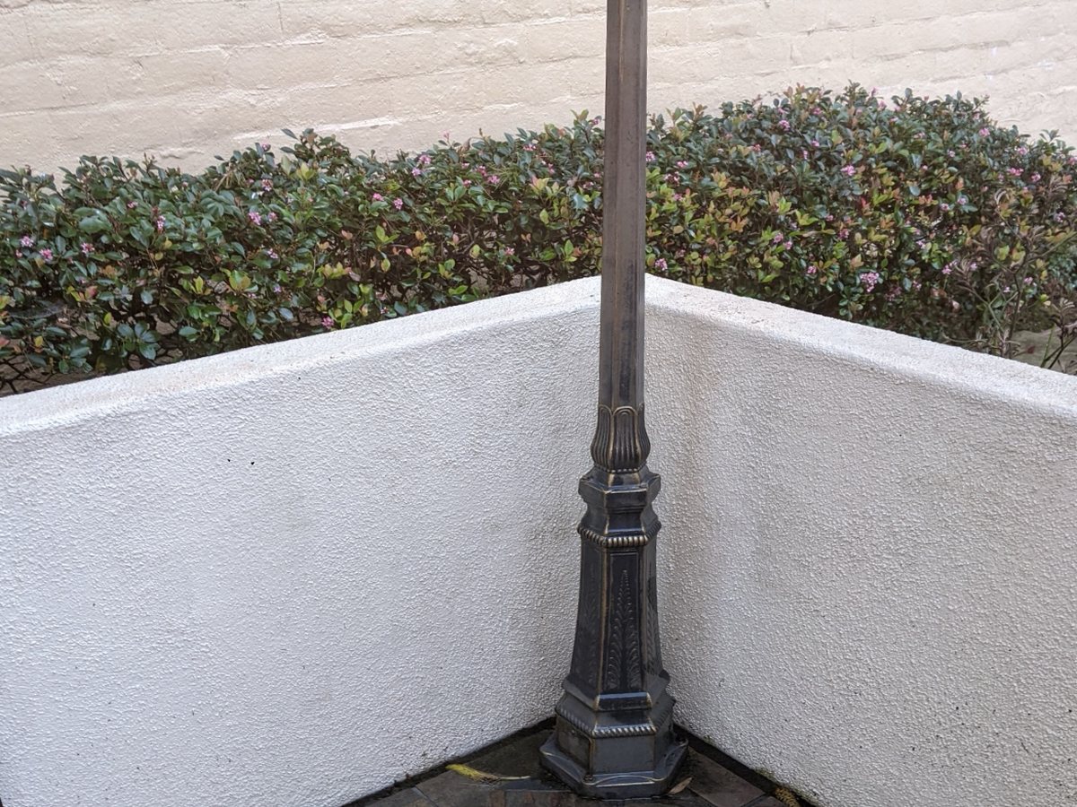 Stucco wall and lamp post after washing